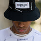 Reversible black/white multi logo bucket hat